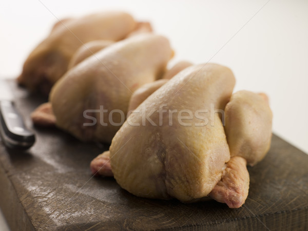 Three Whole Poussins on a Chopping Board Stock photo © monkey_business