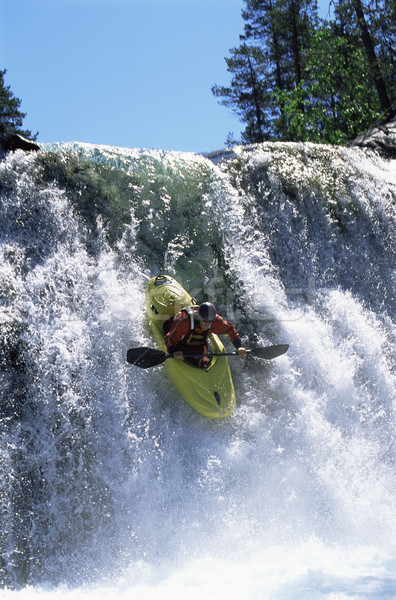 Junger Mann Kajakfahren nach unten Wasserfall Mann Fluss Stock foto © monkey_business