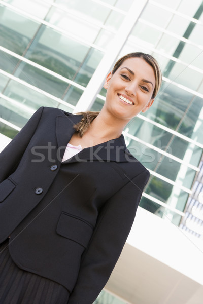 Businesswoman standing outdoors smiling Stock photo © monkey_business