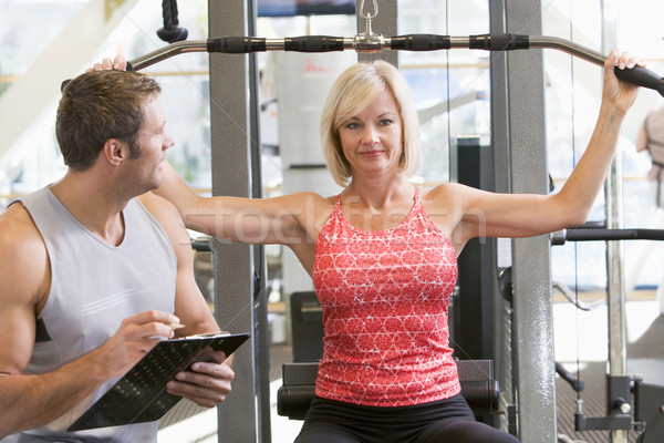 Personal Trainer Watching Woman Weight Train Stock photo © monkey_business