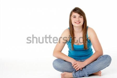 Stock photo: Studio Portrait Of Happy Teenage Girl