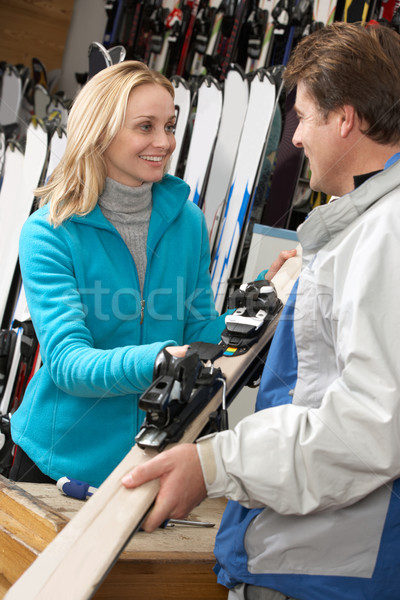 Female Sales Assistant Handing Skis To Customer In Hire Shop Stock photo © monkey_business
