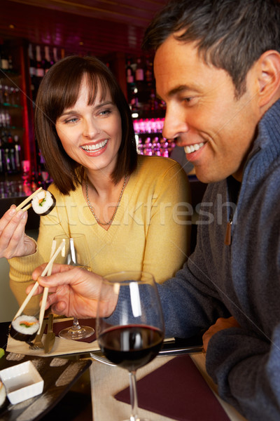 Couple Enjoying Sushi In Restaurant Stock photo © monkey_business