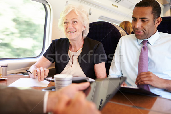 Group Of Businesspeople Having Meeting On Train Stock photo © monkey_business