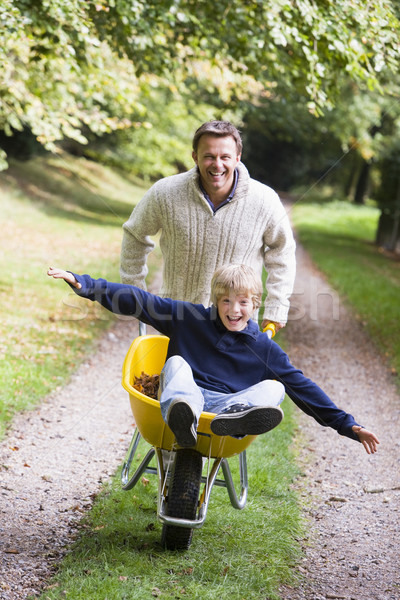 Man zoon kruiwagen najaar pad boom Stockfoto © monkey_business