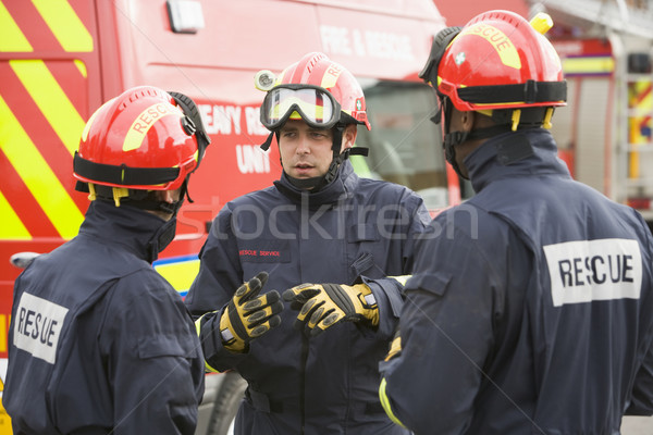 Feuerwehrmann Anleitung Team Mann Sitzung sprechen Stock foto © monkey_business