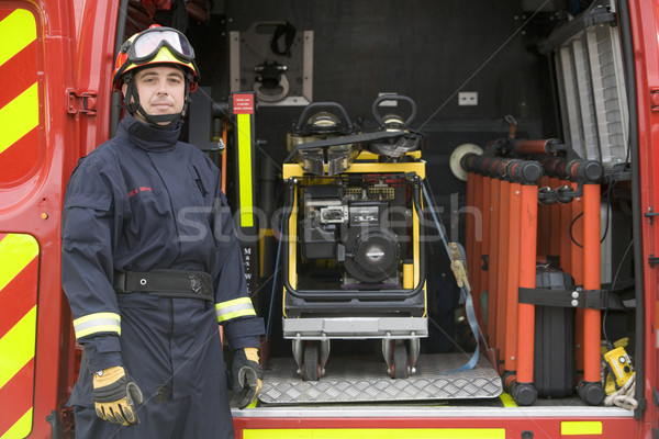 Bombeiros em pé equipamento pequeno carro de bombeiros retrato Foto stock © monkey_business
