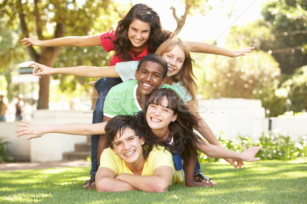 Group Of Teenagers Piled Up In Park Stock photo © monkey_business