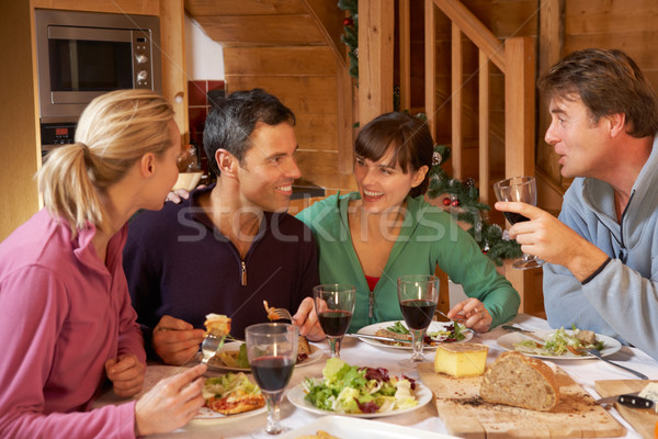 Group Of Friends Enjoying Meal In Alpine Chalet Together Stock photo © monkey_business