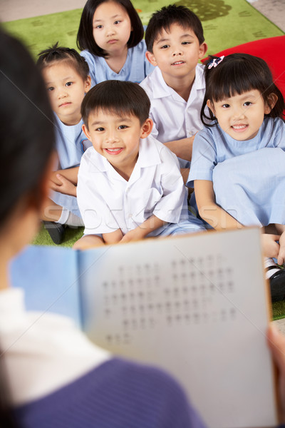 Insegnante lettura studenti cinese scuola classe Foto d'archivio © monkey_business