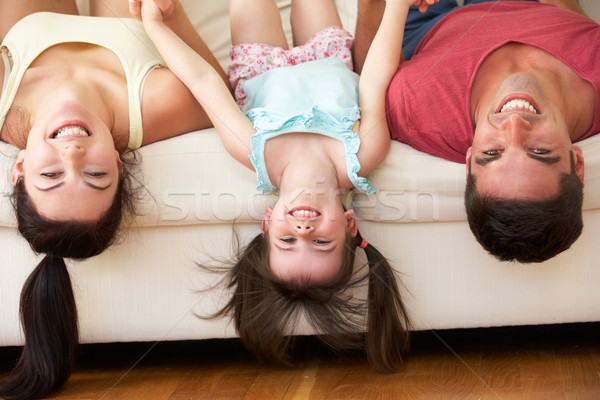 Család fejjel lefelé kanapé lánygyermek lány nők Stock fotó © monkey_business
