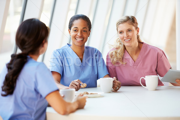 Group Of Nurses Chatting In Modern Hospital Canteen Stock photo © monkey_business