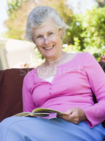 Senior woman reading book outside Stock photo © monkey_business
