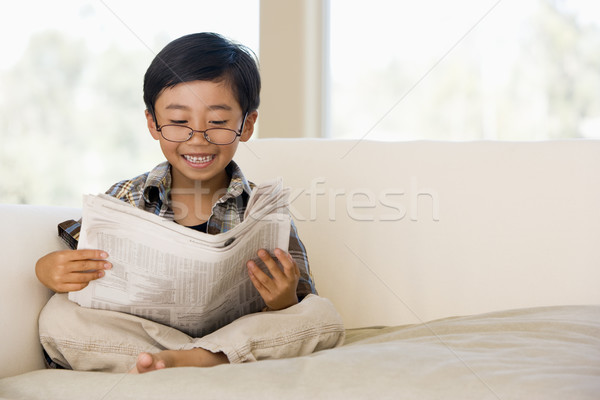 Young Buy Sitting On A Sofa At Home, Pretending To Be A Grown Up Stock photo © monkey_business