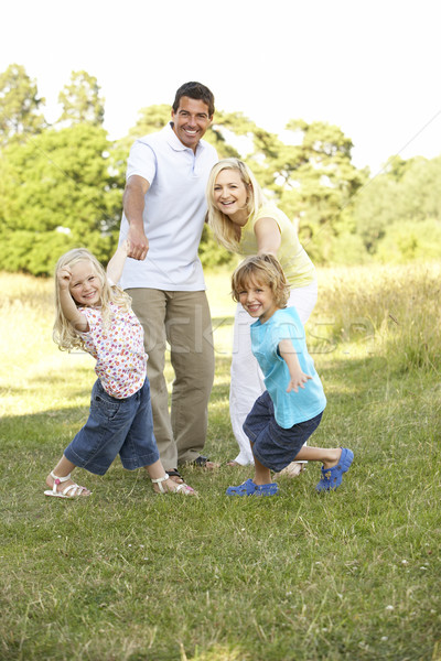 Family having fun in countryside Stock photo © monkey_business