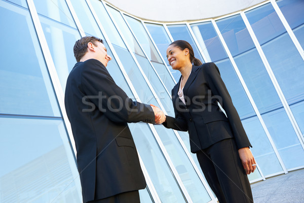 Empresário empresárias aperto de mãos fora escritório negócio Foto stock © monkey_business