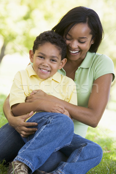 Woman and young boy outdoors embracing and smiling Stock photo © monkey_business