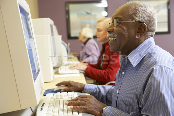 Idős férfi számítógéphasználat számítógép internet monitor Stock fotó © monkey_business
