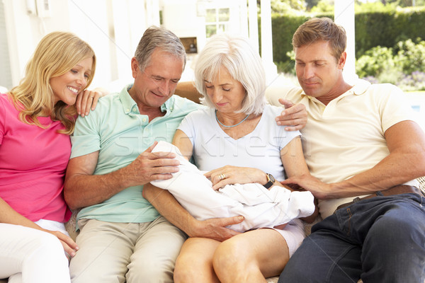 Extended Family Relaxing Together On Sofa With Newborn Baby Stock photo © monkey_business