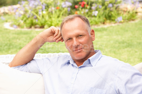 Middle Aged Man Relaxing In Garden Stock photo © monkey_business