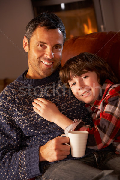 отцом сына расслабляющая горячий напиток смотрят телевизор Сток-фото © monkey_business