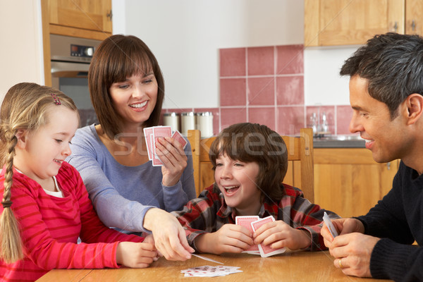 Família cartas de jogar cozinha menina crianças homem Foto stock © monkey_business