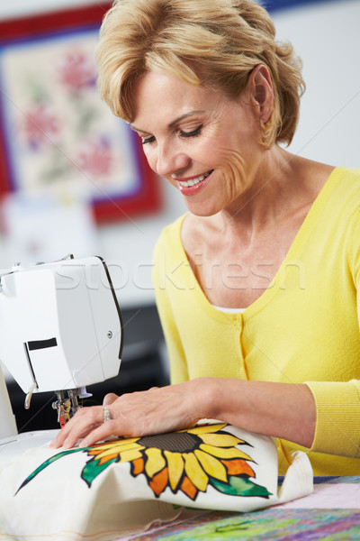 Woman Using Electric Sewing Machine Stock photo © monkey_business