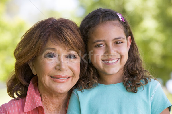 Grandmother and granddaughter smiling Stock photo © monkey_business