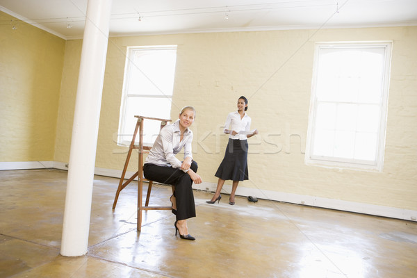 Két nő létra üres hely tart papír mosolyog Stock fotó © monkey_business