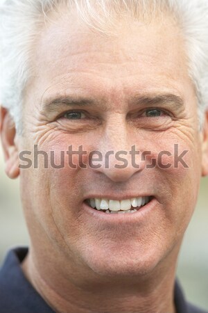 Portré középkorú férfi mosoly szexi szemek háttér Stock fotó © monkey_business