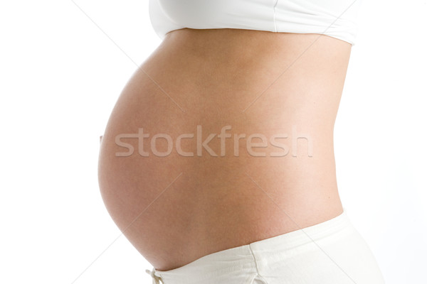 Pregnant woman's exposed belly Stock photo © monkey_business