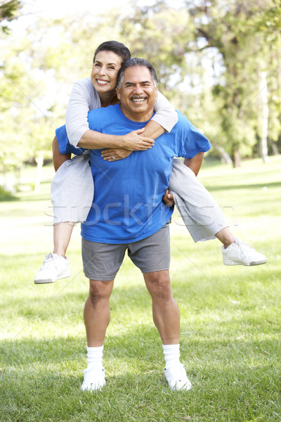 Senior Couple In Sports Clothing Having Fun In Park Stock photo © monkey_business