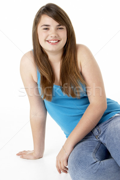 Stock photo: Studio Portrait Of Happy Teenage Girl