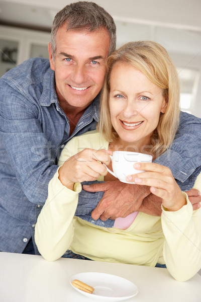 Mid age couple with coffee at home Stock photo © monkey_business