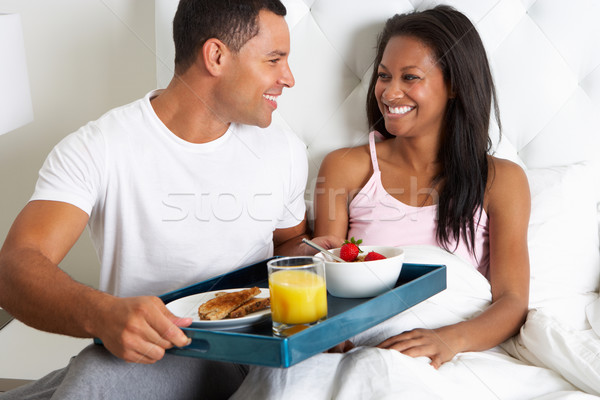 Man Bringing Woman Breakfast In Bed On Tray Stock photo © monkey_business