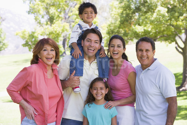 Extended family standing outdoors smiling Stock photo © monkey_business