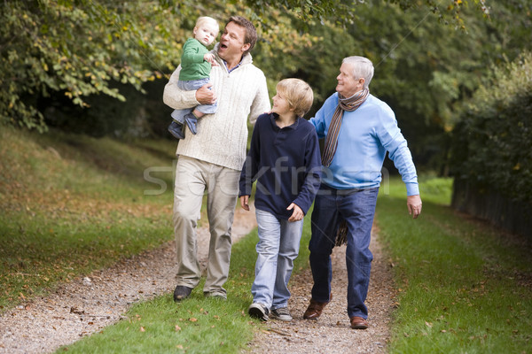 Grandfather walking with son and grandchildren Stock photo © monkey_business