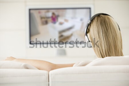 Stockfoto: Man · woonkamer · hoofdtelefoon · televisie