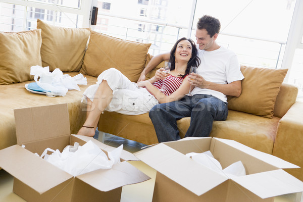 Couple détente champagne cases nouvelle maison souriant [[stock_photo]] © monkey_business