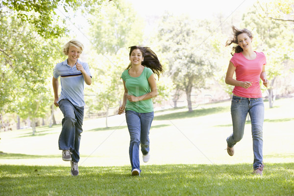 Teenagers Running Through Park Stock photo © monkey_business