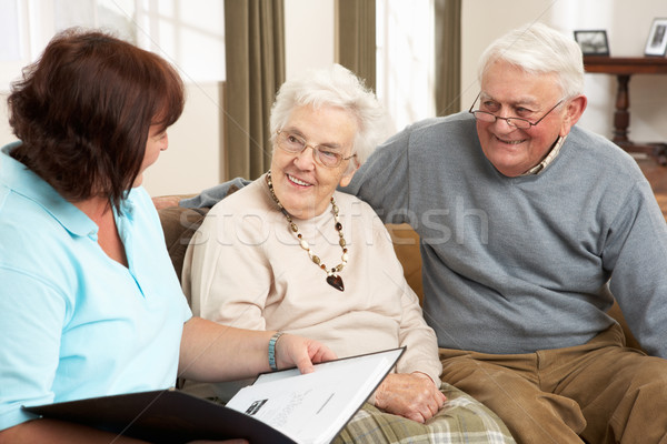 Casal de idosos discussão saúde visitante casa mulher Foto stock © monkey_business
