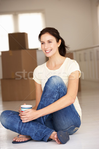 Woman moving into new home Stock photo © monkey_business