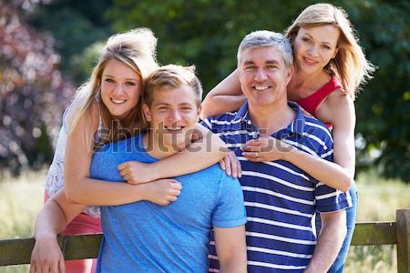 Szülők gyerekek vidék család fű férfi Stock fotó © monkey_business