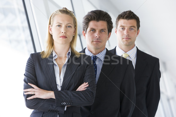 Three businesspeople standing in corridor Stock photo © monkey_business