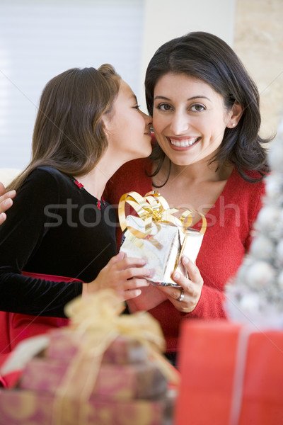 Girl Surprising Her Mother With Christmas Gift Stock photo © monkey_business