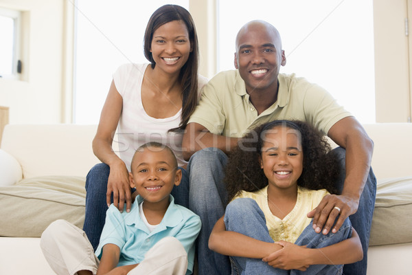 Familie Sitzung Wohnzimmer lächelnd Mädchen Kinder Stock foto © monkey_business