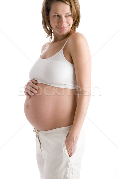 Terhes nő tart védtelen has mosolyog mosoly Stock fotó © monkey_business
