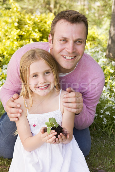 Apa lánygyermek kint tart növény mosolyog Stock fotó © monkey_business