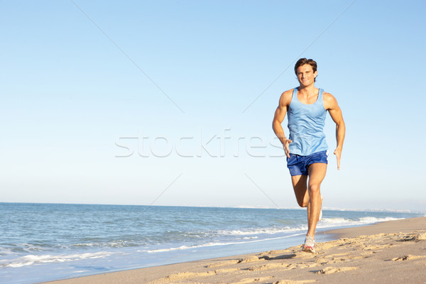 Genç uygunluk giyim çalışma plaj adam Stok fotoğraf © monkey_business
