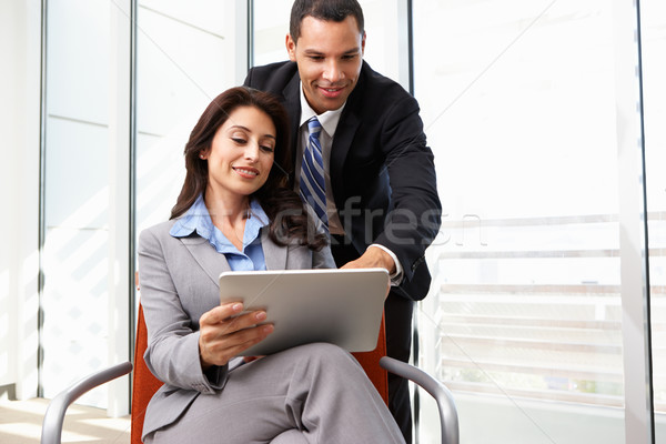 Businesspeople With Digital Tablet During Informal Meeting Stock photo © monkey_business